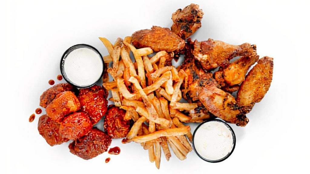 15 Piece Wing Pack · 15 Pit-Smoked Bone-In or Traditional Boneless Wings with choice of up to 2 sauces, 1 large side, veggie sticks, and 2 dips