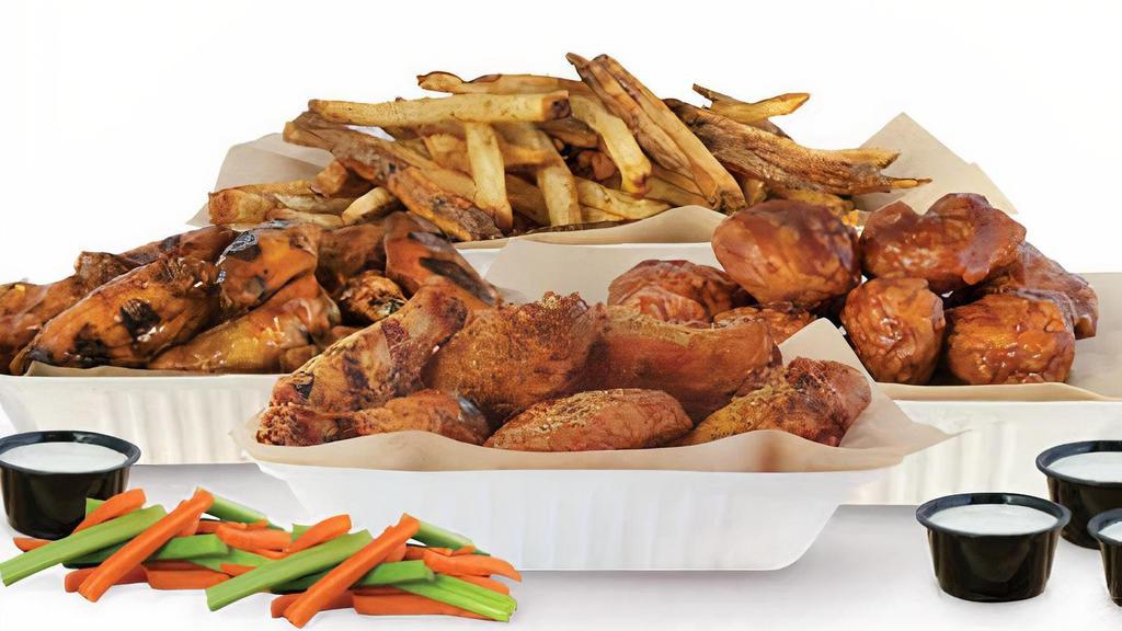 40 Piece Pack · 40 Pit-Smoked Bone-In or Traditional Boneless Wings with choice of up to 4 sauces,1 large side, veggie sticks and 4 dips