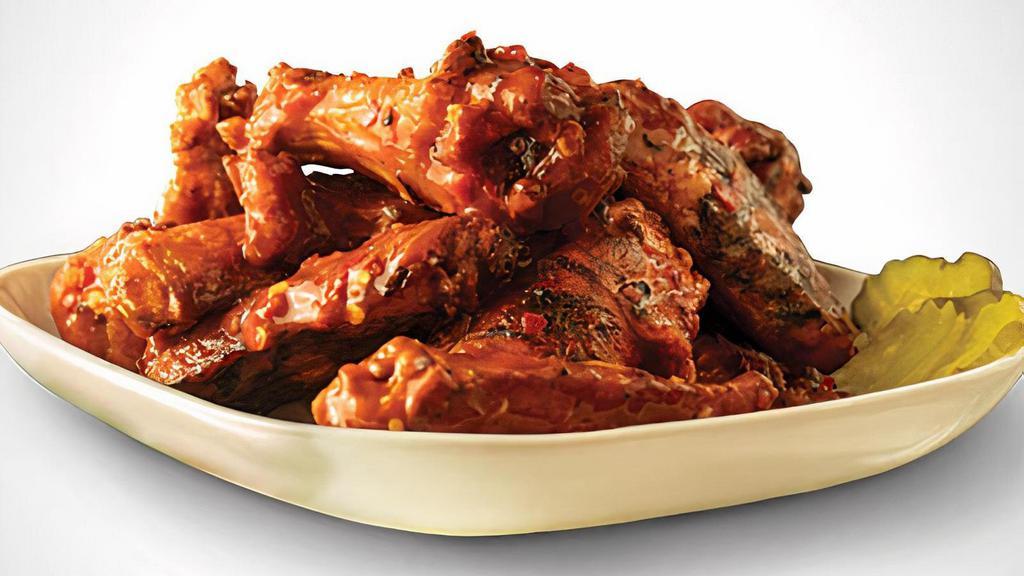 6 Wings · 6 Pit-Smoked Bone-In or traditional Boneless wings with up to 1 sauces *Dips & Veggie Sticks not Included*