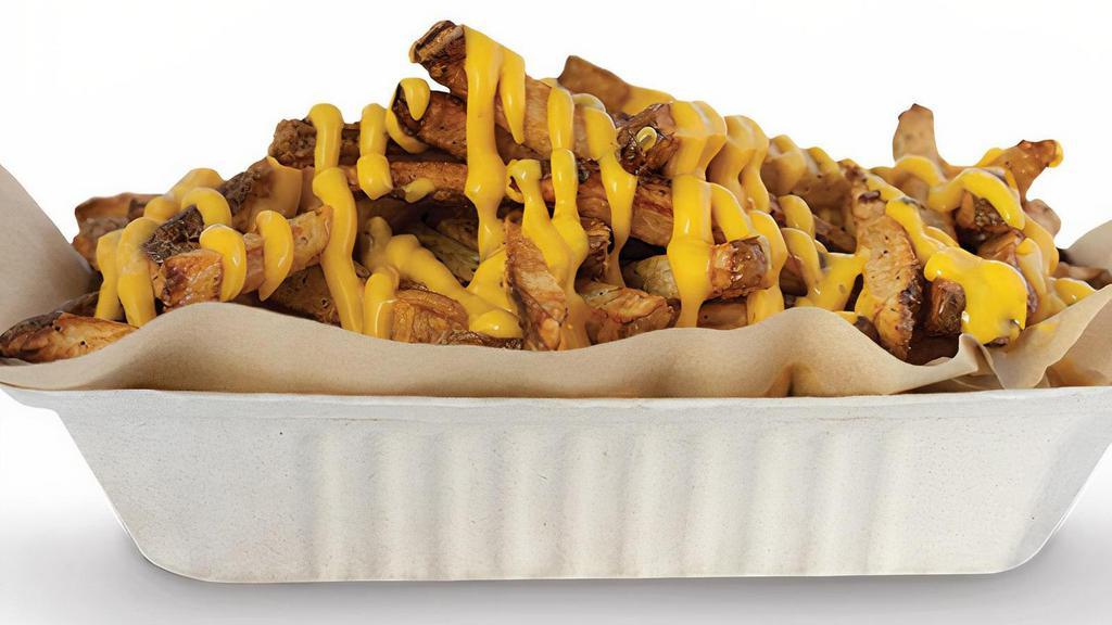 Jalapeño Cheese Hand-Cut Fries · Large portion smothered with jalapeño cheese sauce