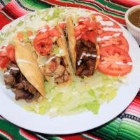Crispy Tacos · Hard Shell Corn Tortilla with your choice of meat, lettuce, tomatoes, sour cream, cotija che...