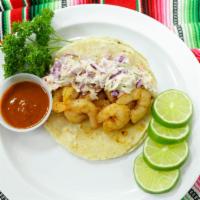 Shrimp Taco · Seasoned , battered and lightly fried.  Topped with coleslaw, limes and salsa on the side.