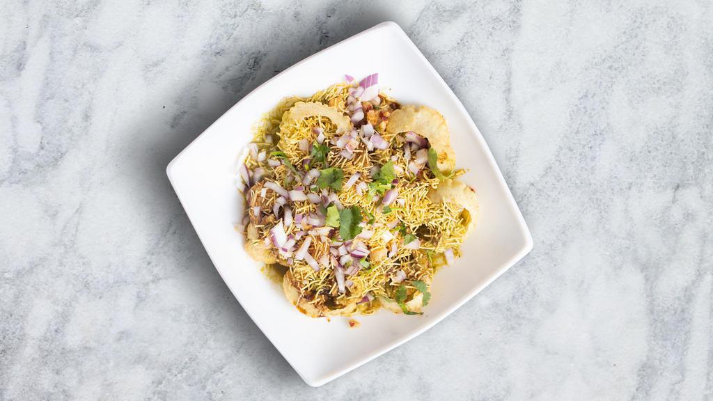Sev Puri · Vegan. Deep-fried bread filled with mashed potatoes, onions, spices, sev, and chutneys.