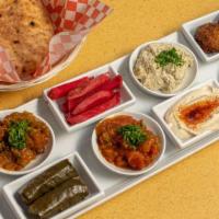 Sampler Platter · Hummus, Turkish salad dip, baba ganoush, spicy eggplant, pickles, tahini, two falafel balls,...