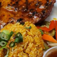 Chicken Inasal with Rice · Grilled chicken marinated in coconut and calamansi.