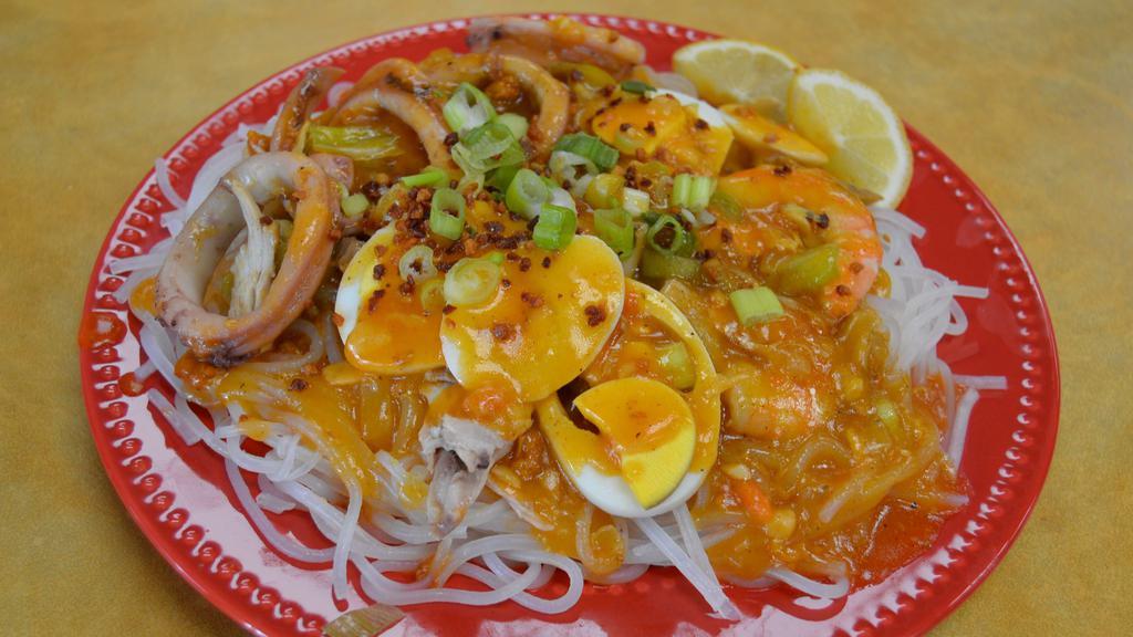 Pancit Luglug Malabon · Noodles, with ground pork, shrimp, chicharron, and boiled eggs.