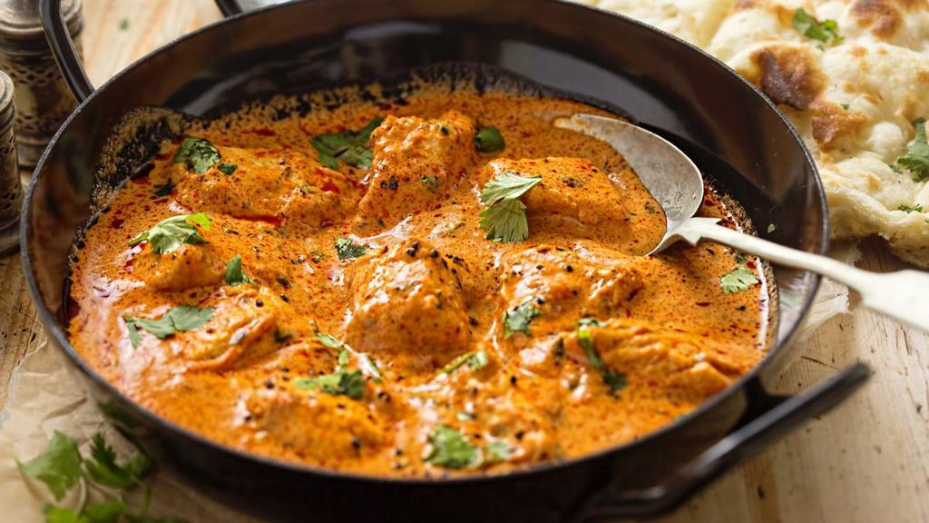Butter Chicken · Chunks of roasted marinated chicken in a spiced curry sauce.