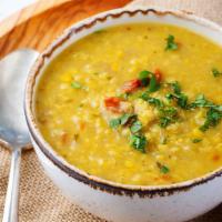 Yellow Dal Curry · Cooked yellow lentils tempered with Indian spices and herbs. Served with basmati rice.