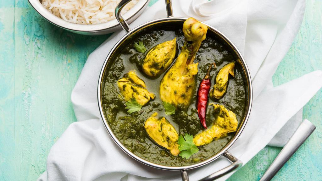 Chicken Saag Curry · Marinated boneless chicken in a fresh green spinach curry. Served with basmati rice.