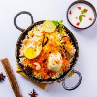 Egg Biryani · Basmati rice marined with Indian spices, fresh eggs, and locally grown seasonal vegetables.