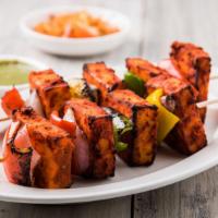 Paneer Chili · Marinated and battered Indian cheese drizzled in a spicy chili sauce.