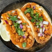 Butter Chicken (Naan Tacos) · Two mini garlic naans with masala marinated chicken, creamy curry butter sauce, red onions, ...