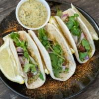 Lamb Kebab (Street Tacos) · Ground lamb marinated in kebab spices, red onions, mint sauce and fresh cilantro. (3 Tacos)