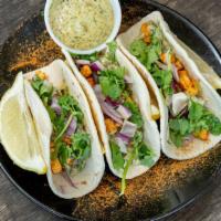 Tandoori Paneer (Street Tacos) · Tandoori paneer, red onions, mint sauce and fresh cilantro, three tacos.