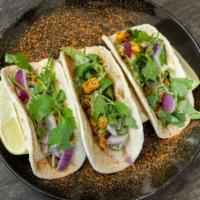 Masala Cauliflower (Street Tacos) · Masala cauliflower, red onions, mint sauce and fresh cilantro.
