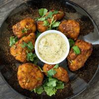 Tandoori Wings (Bone-in) · Yogurt based chicken wings marinated with tandoori flavors and spices, topped with fresh cil...