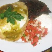 Huevos Rancheros · Two eggs over easy on two grilled corn tortilla with pepper jack cheese drenched in salsa ve...