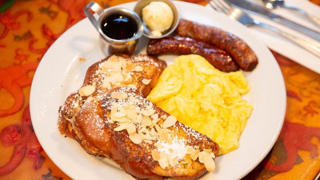 Deuces Wild · Two pancakes or two pieces French toast (has almonds) with two eggs any style and two bacon, two sausages or two veggie sausage.