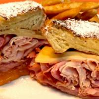 Monte Cristo · Challah bread French toast sandwich with honey smoked ham, smoked turkey, swiss, and cheddar...