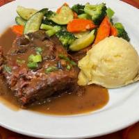 Rudy's Meatloaf · Served with mashed potatoes, mushroom bacon beer gravy and mixed veggies.