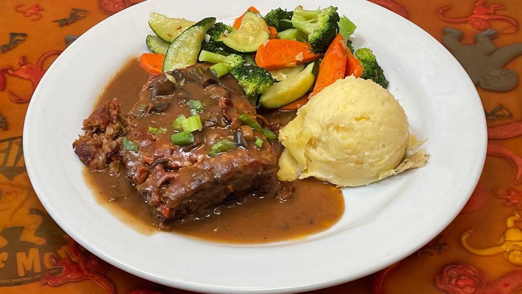 Rudy's Meatloaf · Served with mashed potatoes, mushroom bacon beer gravy and mixed veggies.