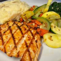Grilled Salmon · Served with mashed potatoes and garlicky mixed veggies.
