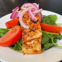 Grilled Salmon Salad · 6 ounce grilled salmon filet on a bed of spinach with tomato, red onion and citrus vinaigret...