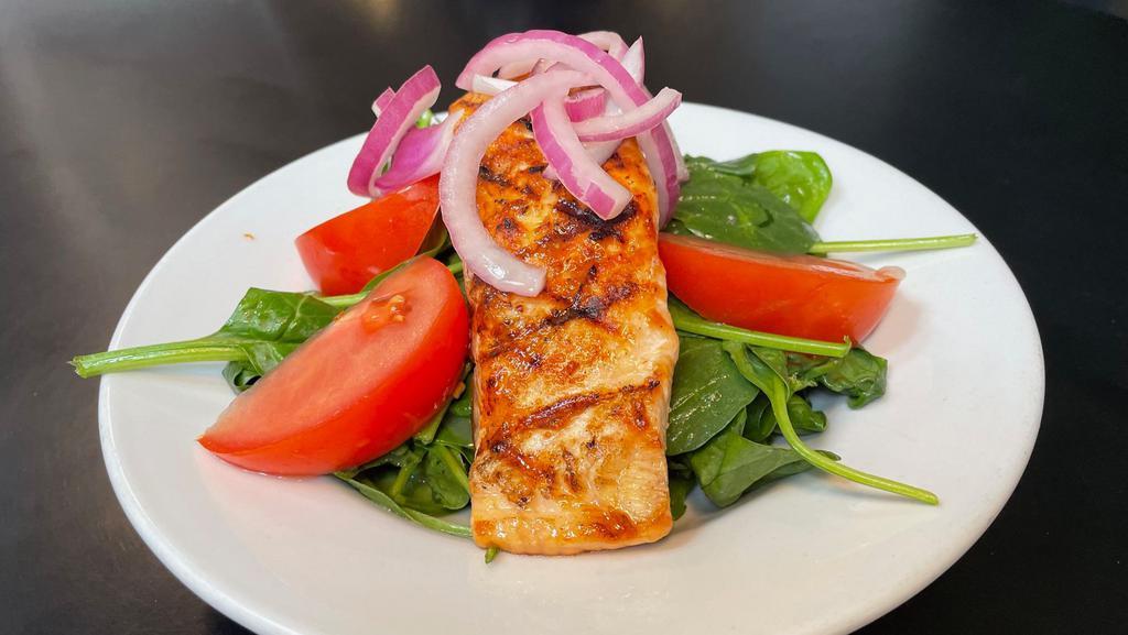 Grilled Salmon Salad · 6 ounce grilled salmon filet on a bed of spinach with tomato, red onion and citrus vinaigrette.