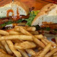 Buffalo Chicken Sandwich · Grilled chicken breast in a buffalo sauce with crumbled bleu cheese, applewood smoked bacon,...