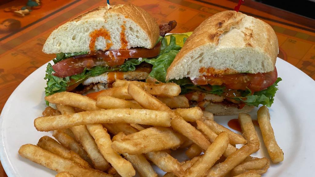Buffalo Chicken Sandwich · Grilled chicken breast in a buffalo sauce with crumbled bleu cheese, applewood smoked bacon, lettuce, tomato, onion, and mayo on a French roll.