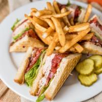 Mile High Club · Triple decker with smoked turkey, applewood smoked bacon, lettuce, tomato, and mayo cut into...