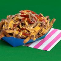 Philly Loaded Fries · Fries topped with melty cheese, steak, yellow onions, and bell peppers.  This’ll really ring...