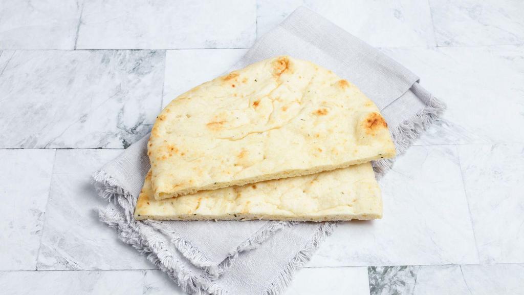 Garlic Naan by dosa by DOSA · By dosa by DOSA. Indian style flatbread with roasted garlic, a favorite side to every Indian curry, dal, and rice.  Contains gluten, dairy, soy, and eggs. We cannot make substitutions.
