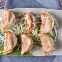 5. Pot Stickers (6) · Homemade with ground pork cabbages carrot in secret ingredients. and dipping sauce