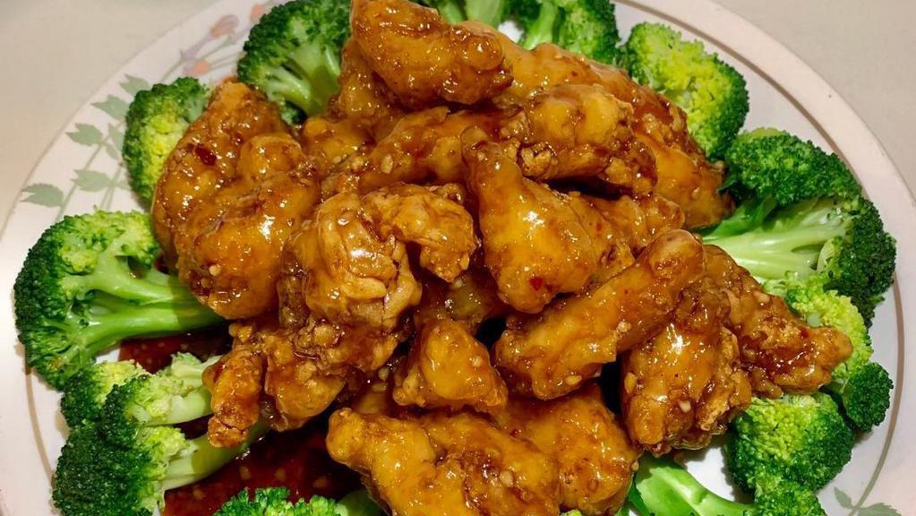 1. General Tso's Chicken · Lightly breaded fried chicken in secret formula spicy garlic sauce garnished with broccolis