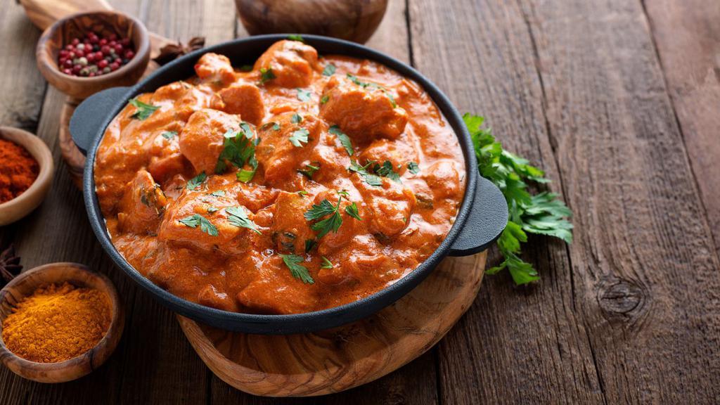 Butter Chicken · Creamy tomato base covered with boneless chicken.