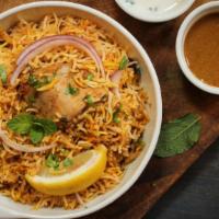 Hyderabad Dum Biryani · Marinated basmati rice cooked with chicken.