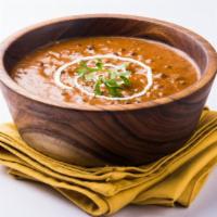 Daal makhani · Creamy lentil stew prepared with garlic, tomatoes, and fresh spices.