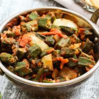 Vegan Okra Masala · Farmers market fresh okra marinated with onions, tomatoes, and Indian spices.