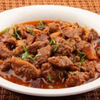 Lamb Curry · Savory lamb cooked in a cumin, ginger, garlic, and tomato base.