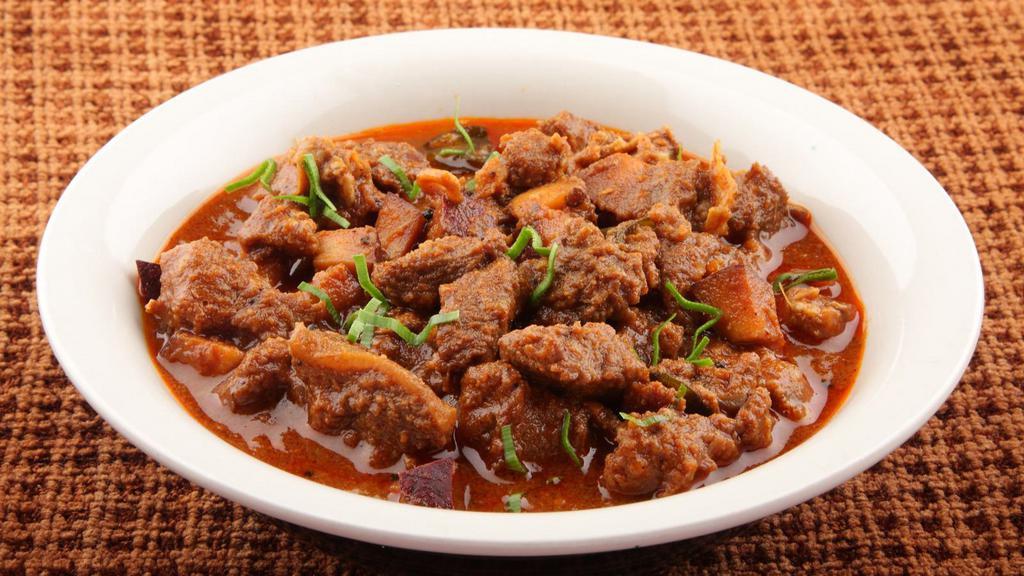 Lamb Curry · Savory lamb cooked in a cumin, ginger, garlic, and tomato base.