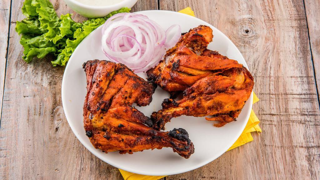 Full Tandoori Chicken · Bone-in four pieces of marinated chicken cooked in the clay oven.