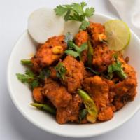 Chicken 65 · Marinated chicken thigh prepared with curry leaves and savory yogurt.