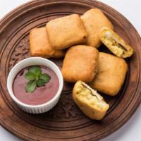 Paneer Pakoras · Indian cheese dipped in chickpea batter, ginger garlic, and Indian spices.