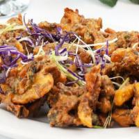 Veggie Pakoras · Farmers market seasonal vegetables dipped in chickpea batter, ginger garlic, and Indian spic...