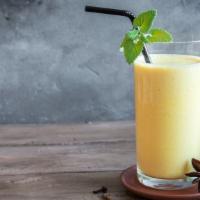Mango Lassi · Yogurt based drink with mangoes and all natural flavors. gluten-free.
