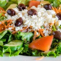 Greek Salad · Leaf lettuce, tomato, cucumber, red onions, Feta cheese, carrots, and kalamata olives.