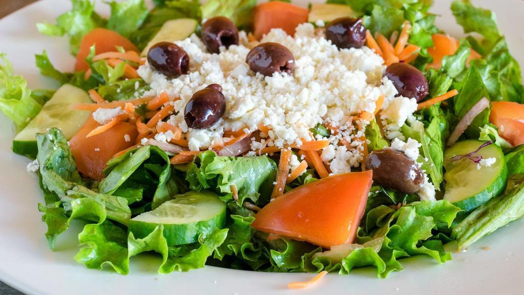 Greek Salad · Leaf lettuce, tomato, cucumber, red onions, Feta cheese, carrots, and kalamata olives.