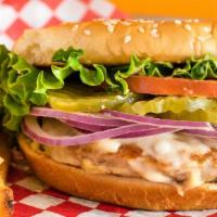 The Birdie Burger · Turkey burger topped with Swiss cheese. Served with tomato, lettuce, pickles, onions, house ...
