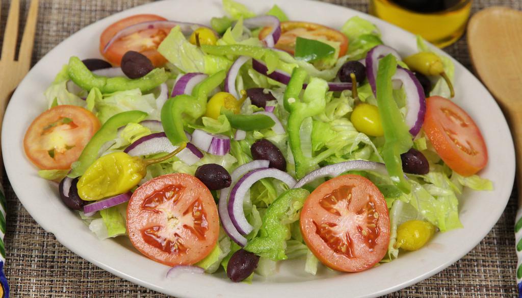 Garden Salad · Romaine lettuce, tomato, red onion, black olives, pepperoni, and bell peppers. It comes with Ranch dressing.